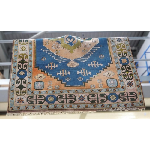 3270 - Fringed & Bordered Geometric Woolen Rug On Blue Ground. Approx. 320 x 235cm