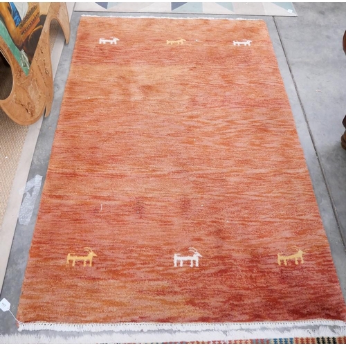 3293 - Fringed Woolen Rug On Orange Ground. Approx. 180cm X 125cm