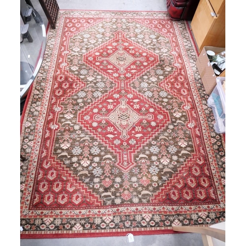 3415 - Geometric Woolen Rug On Red Ground. Approx. 102 x 62cm.