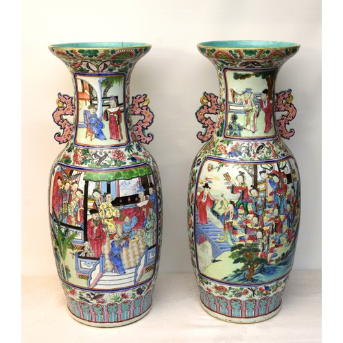 Large Pair of Antique Chinese Qing Dynasty Vases. Decorated with multiple Panels of figures in palatial grounds, painted with colourful foliage and all manner of insects, Dragon handles, approx 62cm tall.