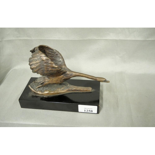 1258 - Modern Bronze Sculpture, Swan taking off, supported on black wood base, monogram signature.