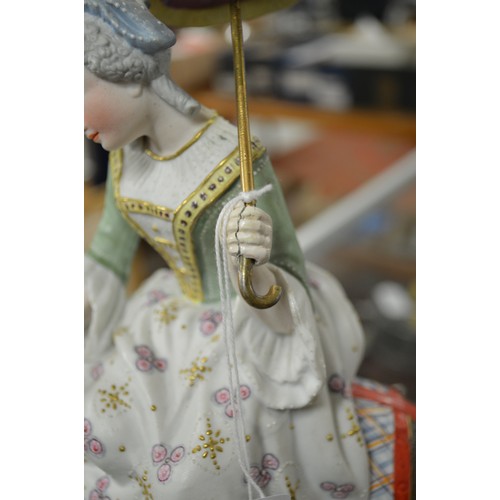 1121 - Antique Bisque Porcelain Figure - Lady on Donkey holding a Parasol, approx 31cm tall.