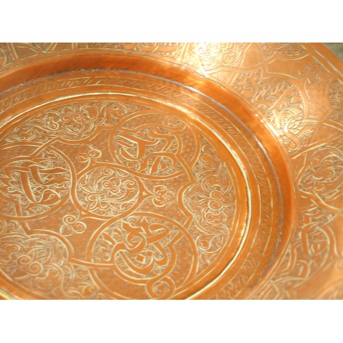 1282 - Antique Islamic Engraved Copper Dish, approx 30cm in diameter.