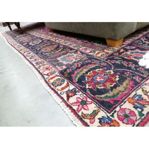 Eastern Fringed & Bordered Wool Rug On Red Ground. Approx. 325cm X 247cm