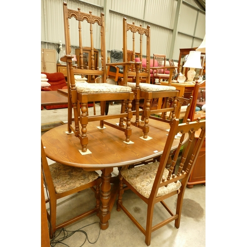 Ercol Extending Table with 6 Carved Chairs