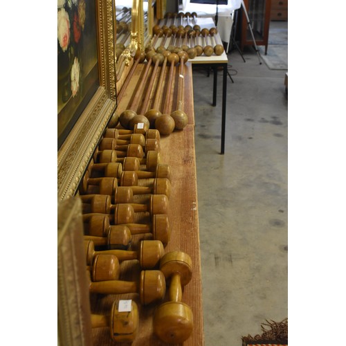 Twenty One Antique Turned Wood Gymnastic Wands (often called Calisthenics Bar-bells, Excercise Wands or Drill Rods) dating from the late 19th to mid 20th century. Along with ten pairs of wooden Dumbells.