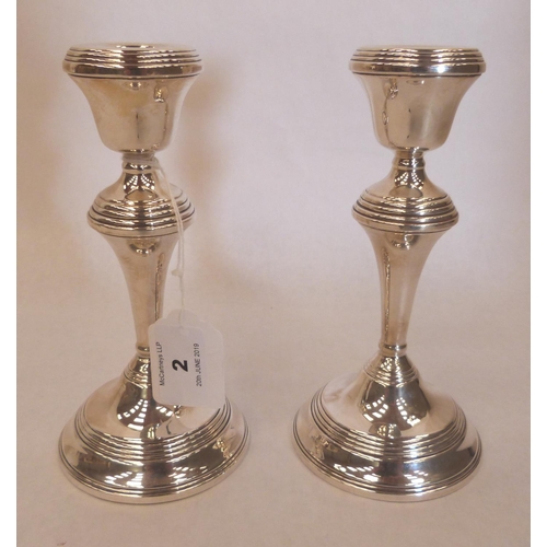 2 - A pair of Elizabeth II silver candlesticks. 7' high. Birmingham 1992. Loaded