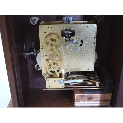 252 - A walnut bracket clock of recent manufacture, the three train German movement striking and chiming o... 