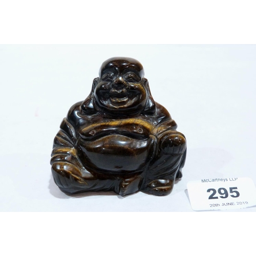 295 - A carved chatoyant tiger's eye Buddha. 2¾' high