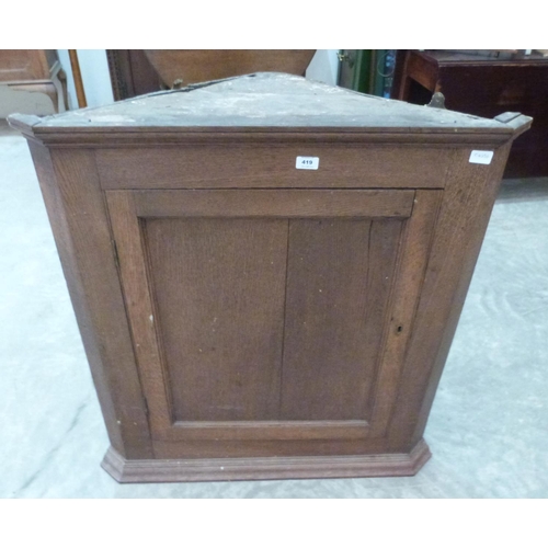 419 - A 19th century oak hanging corner cupboard