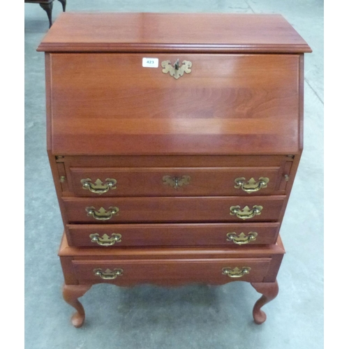 423 - A yew wood bureau of recent manufacture on cabriole legs. 27' wide