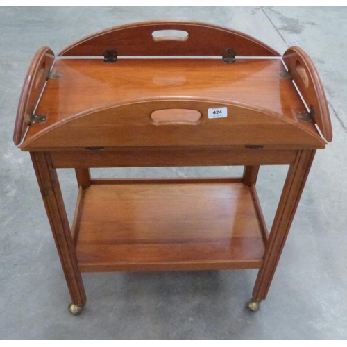 424 - A yew wood serving trolley with drop down sides