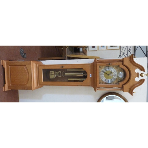 425 - An oak longcase clock of recent manufacture, the three train weight driven movement striking and chi... 