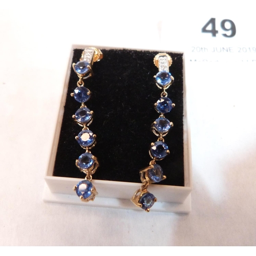 49 - A pair of 9ct blue topaz and diamond drop earrings