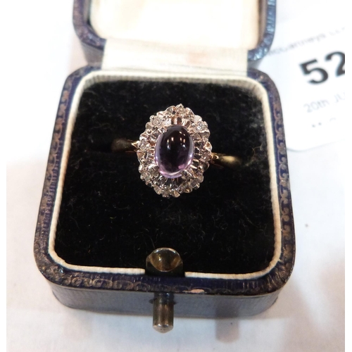 52 - A cabochon amethyst and diamond ring. In golf marked 18. Size N. 4.3g gross