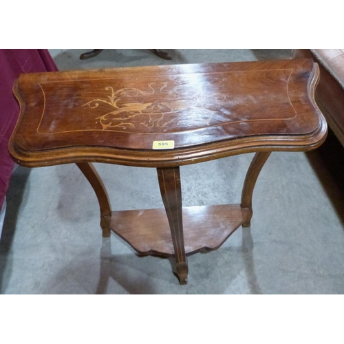 585 - A walnut and inlaid console table. 28' wide