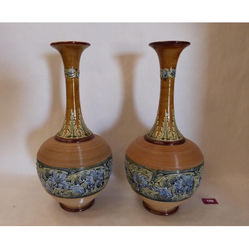 159 - A pair of Doulton Lambeth ware vases, the body decorated with continuous band of blue flowers and fo... 