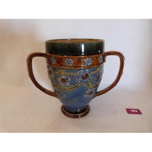 163 - A Royal Doulton stoneware tyg, decorated by Ethel Beard with continuous trailing foliage on a blue g... 