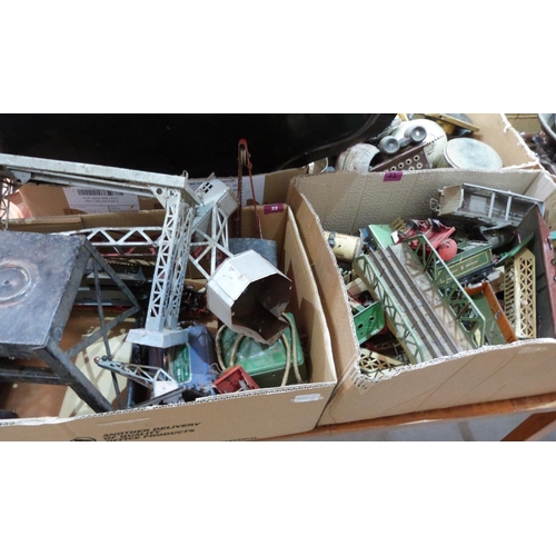 22 - Four boxes of playworn tinplate railway to include rolling stock, signals and track