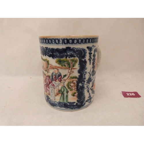 226 - A Chinese blue and white porcelain mug, painted in coloured enamels with figures in a garden and res... 