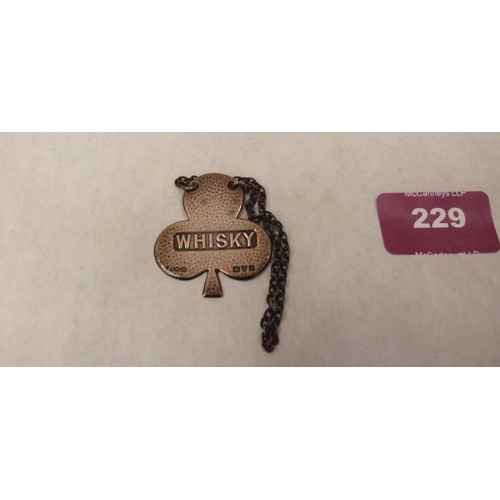 229 - A George V silver whiskey decanter label. Chester 1911