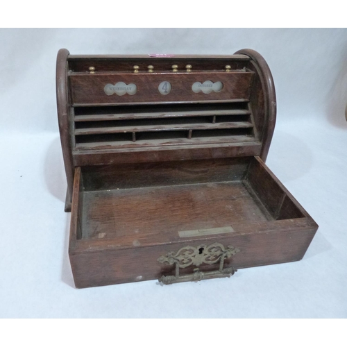 231 - An oak stationary box enclosed by a tambour shutter over a base drawer. 12' wide