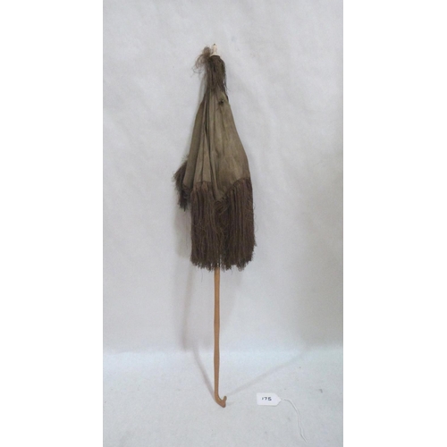 175 - A Victorian silk parasol. 26½' long. (A.F.)