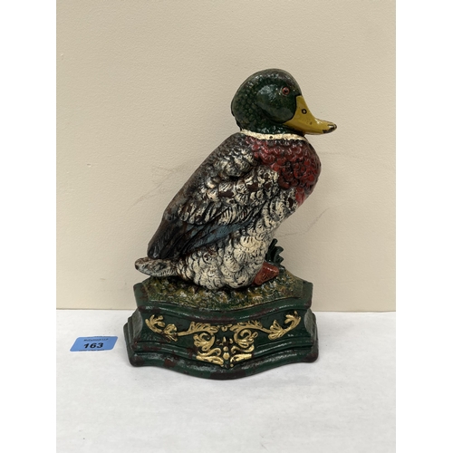 163 - A painted cast iron doorstop in the form of a duck. 9½' high