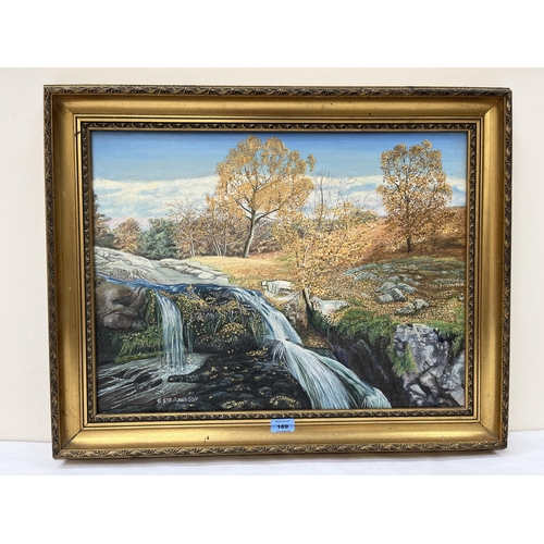 189 - G. STEPHENSON. BRITISH CONTEMPORY  A wooded landscape with waterfall. Signed. Oil on canvas 18' x 24... 