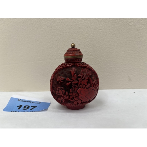 197 - A Chinese carved 'cinnabar' snuff bottle. 2' high