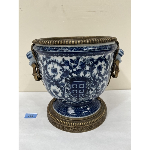 199 - A Chinese blue and white decorated campana urn with bronze mounts. 9¾' high