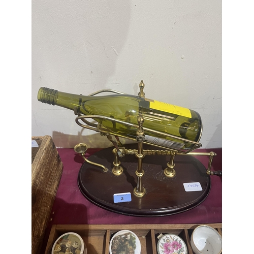 2 - A brass wine bottle stand/pourer on wood base