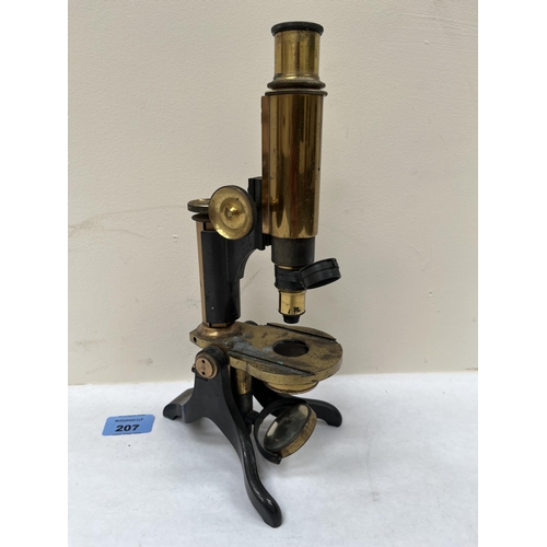 207 - A Victorian brass monocular compound microscope by Baker, High Holborn, London. 11' high