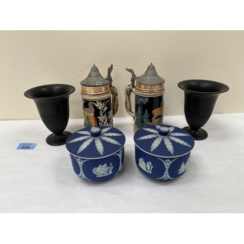 226 - A pair of Wedgwood blue jasparware jars with covers, a pair of black basalt campana vases and two be... 