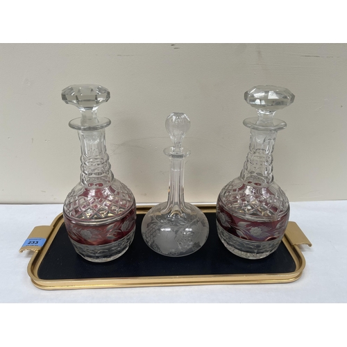 233 - Three cut glass decanters and a metal tray