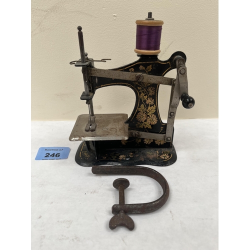 246 - An early 20th century child's sewing machine. 4½' wide