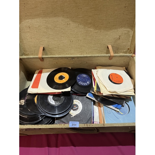 254 - A case of 7' vinyl single records. Assorted.