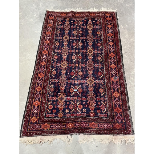 282 - An eastern blue ground rug. 76' x 48'