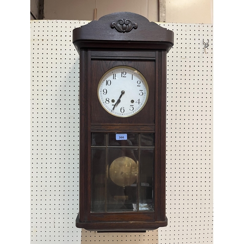 366 - A 1930s oak cased wall clock, the two train movement  striking and chiming on four tubular gongs. 30... 