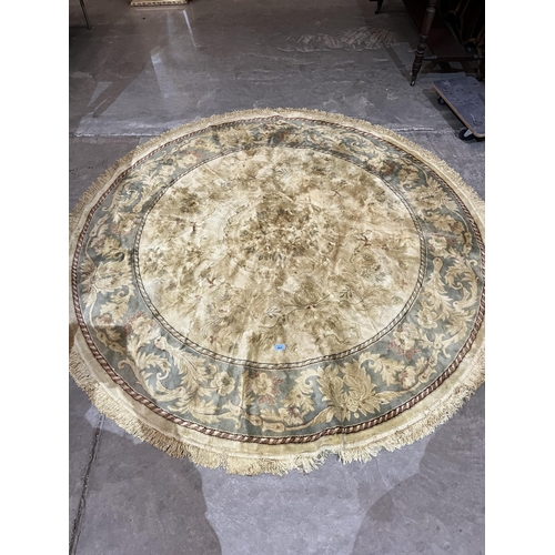 404 - A gold ground circular rug. 78' diam.