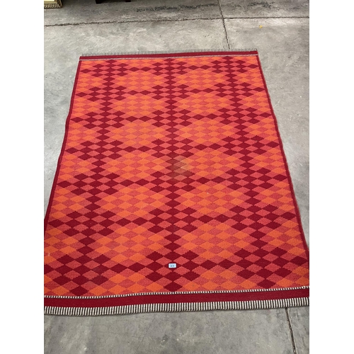 415 - A red ground carpet. 76' x 57'