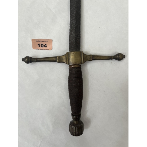 104 - A mediaeval style sword with latten hilt, the wired grip with fluted latten knop pommel. Length of b... 