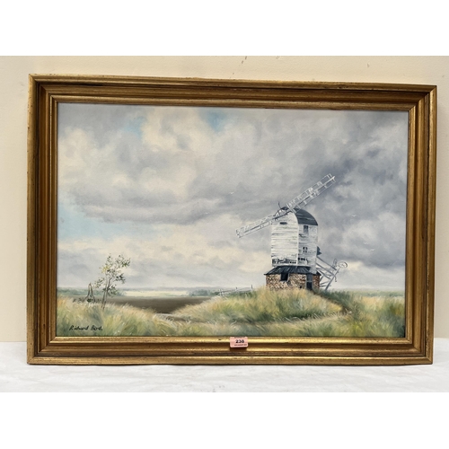 238 - RICHARD BIRD. BRITISH 20TH CENTURY  An East Anglian landscape will mill. Signed. Oil on canvas 20' x... 