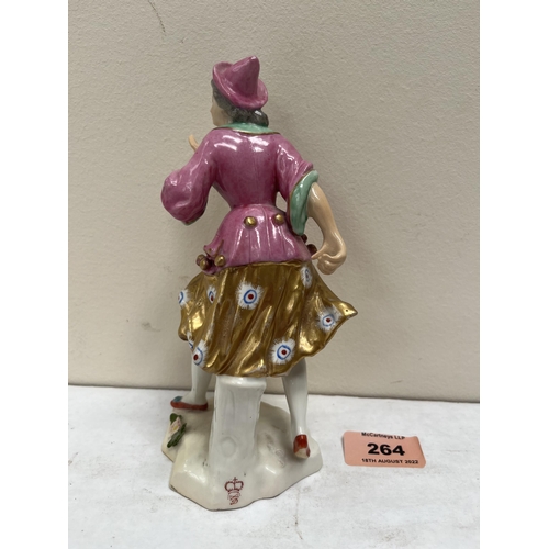 264 - A Derby figure of a lady in brightly coloured clothes and gilded skirt. Crown mark over crossed swor... 