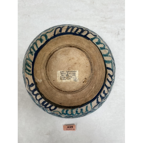 435 - An Iznik style glazed pottery bowl with geometric decoration. 11¼' diam.