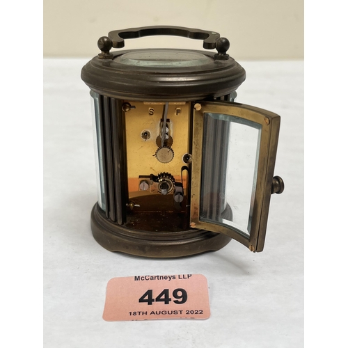 449 - A late 19th century brass ovoid carriage timepiece, the enamel dial signed Matthew Norman, London. 3... 