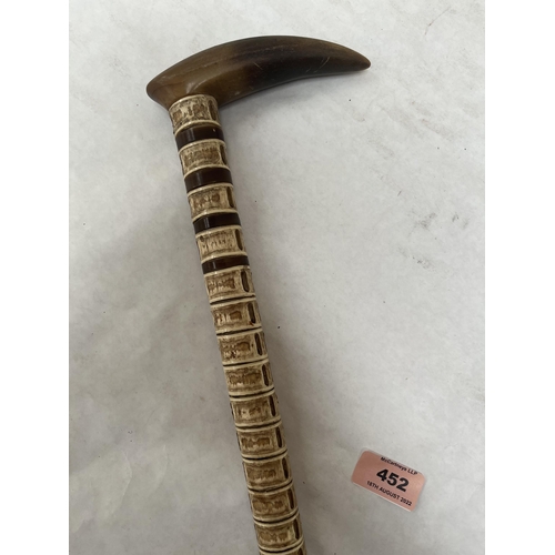 452 - An early 19th century shark vertabrae walking stick with horn handle. 34½' long