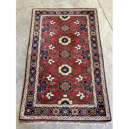 492 - A red ground eastern rug. 61' x 36'