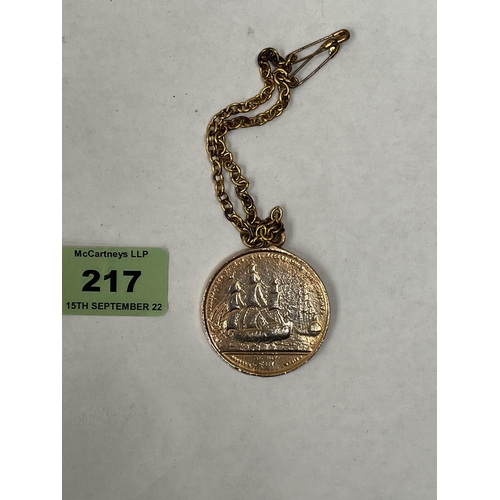 217 - A yellow metal Napoleon medal, 40mm diam on a chain