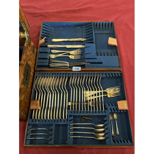 156 - An oak and brass mounted canteen with a part set of plated and loose cutlery in three trays. 17½' wi... 